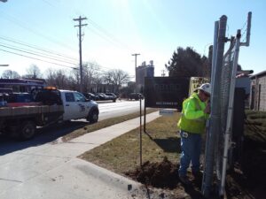 A newly installed wooden privacy fence in a backyard by Pro-Soil Site Services, Inc in Lansing, MI