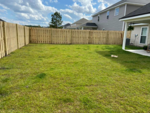 A complete wooden privacy fence installation enclosing a backyard by All In One Fence in Whitehouse Station, NJ.