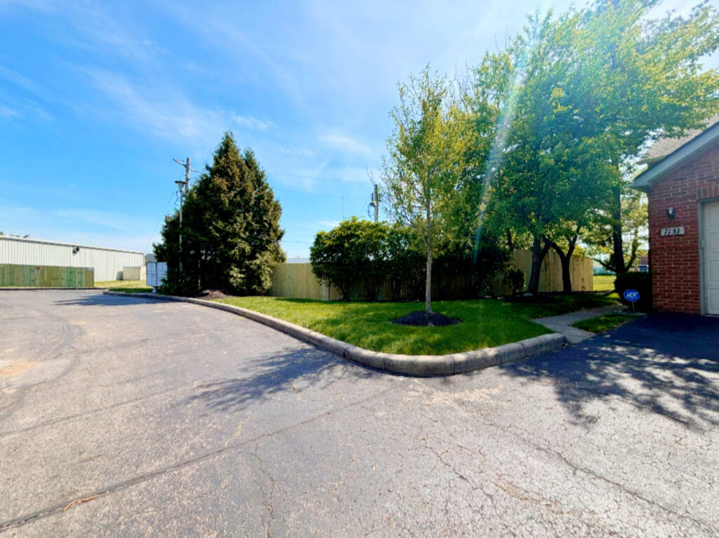 A new wooden privacy fence installed along a property line, showcasing D&M Renovation Services LLC's work in Columbus, OH.