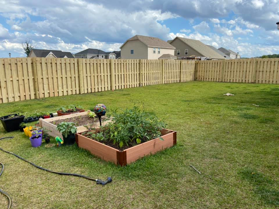 A sturdy wooden privacy fence installed in a residential backyard by All In One Fence in Whitehouse Station, NJ.