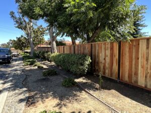A long wooden privacy fence installed along a street-side property by Superior Fence & Rail in San Jose, CA.
