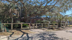 A wooden split-rail fence with a matching gate installed by Gifford Contracting & Repair - Custom Privacy Fencing in Goose Creek, SC.