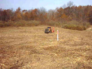 A worker installing a chain-link fence for Pro-Soil Site Services, Inc in Lansing, MI