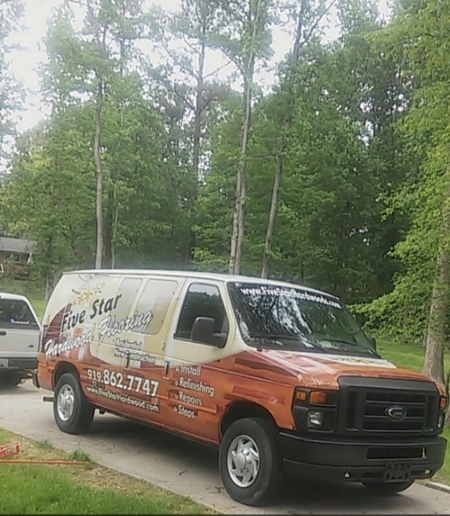A worker unloading rolls of carpet padding from a Five star hardwood flooring LLC van in Sparks, NV.