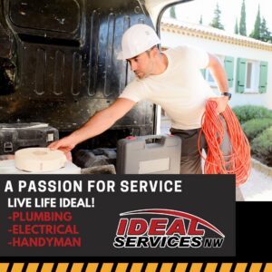 A worker from Ideal Services NW in Fife, WA, unloading a coil of red electrical wire from a service van.