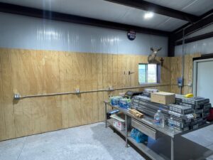 Interior of a workshop showing surface-mounted electrical conduit, outlets, and lighting installed by G5 Electric, LLC in Evansville, IN.