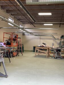 Spiral ductwork installed in a workshop or industrial space by Foremost Mechanical Services in Hartford, CT.