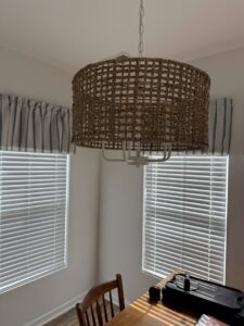 A decorative woven light fixture installed in a room by Strother & Son Electric in Mount Pleasant, SC.