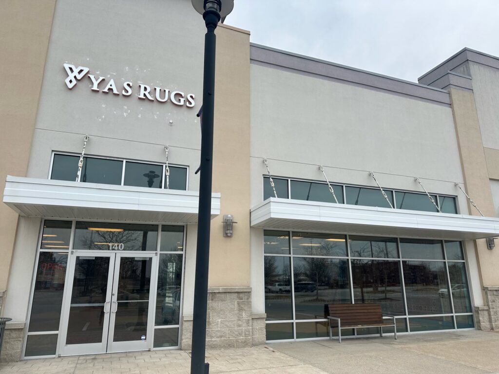 The exterior storefront of Yas Rugs, a carpet contractor business in Lexington, KY.