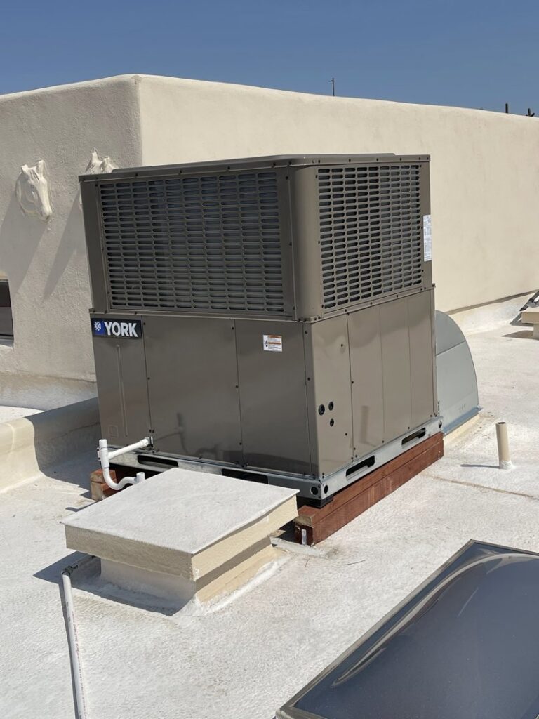 A new York commercial rooftop HVAC unit installation on a building in Peoria, AZ by J & M Cooling & Heating LLC.