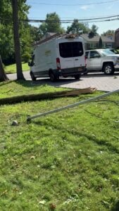 A York Electric of Westchester van at a site with a fallen utility pole or tree branch, indicating emergency electrical service in Yonkers, NY.