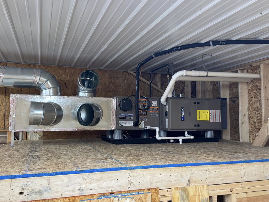 A new YORK furnace and air handler unit with ductwork installed by Erman Mechanical in Fort Wayne, IN