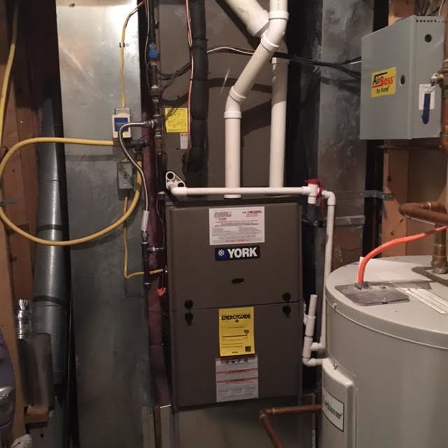 A York furnace and water heater installed in a utility room by Dodrill Comfort & Energy Solutions in Cross Lanes, WV