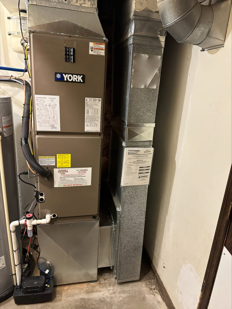 A new York furnace installed alongside a water heater by Dodrill Comfort & Energy Solutions in Cross Lanes, WV