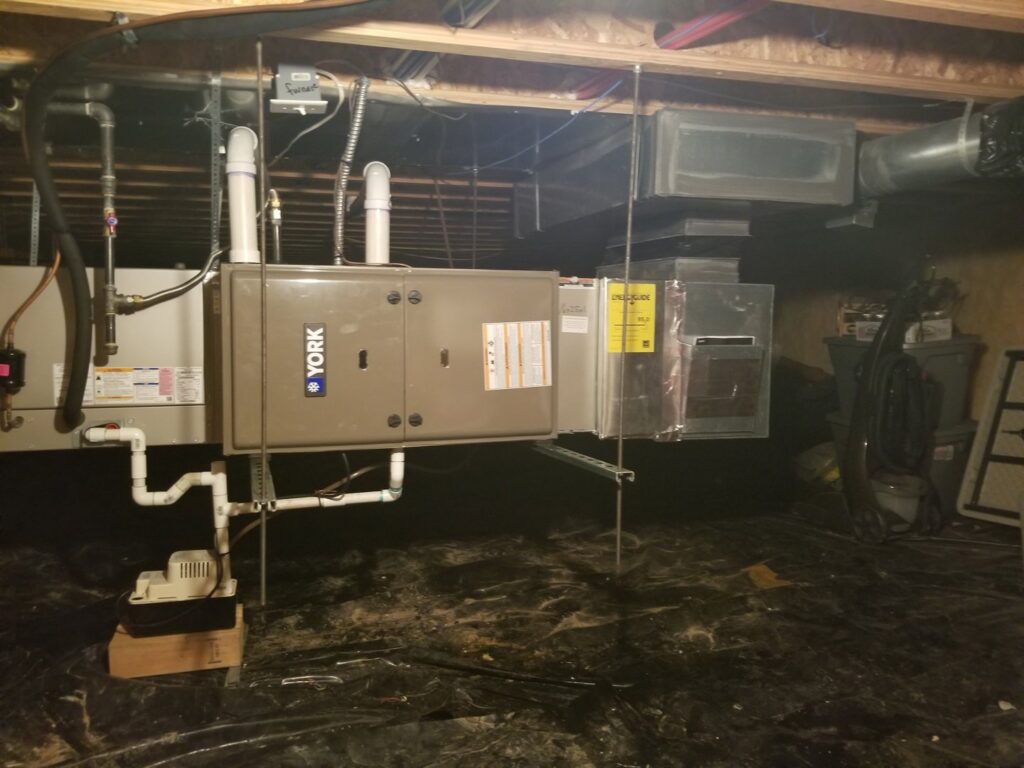 A York horizontal furnace and air handler unit with ductwork installed in a crawl space by Jv Services inc. in Pinellas Park, FL.