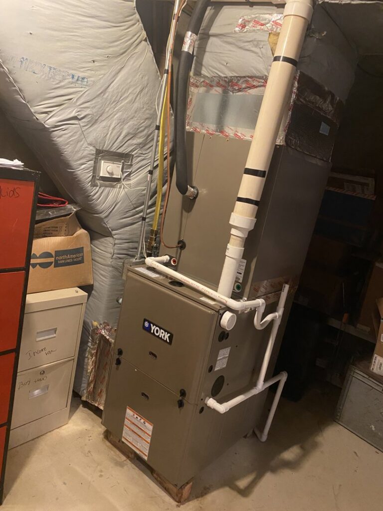 A York HVAC system, including a furnace and air handler, installed in a basement by Grozier Heating and Air Conditioning, LLC in Allentown, PA.