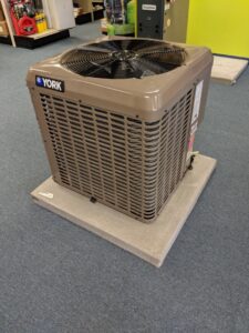 A new York outdoor air conditioning unit on display at Goodpaster's Mechanical, Inc. in Broken Arrow, OK.