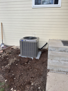 A newly installed York outdoor air conditioning unit next to a home by R&R Mechanical Services in Greeley, CO.