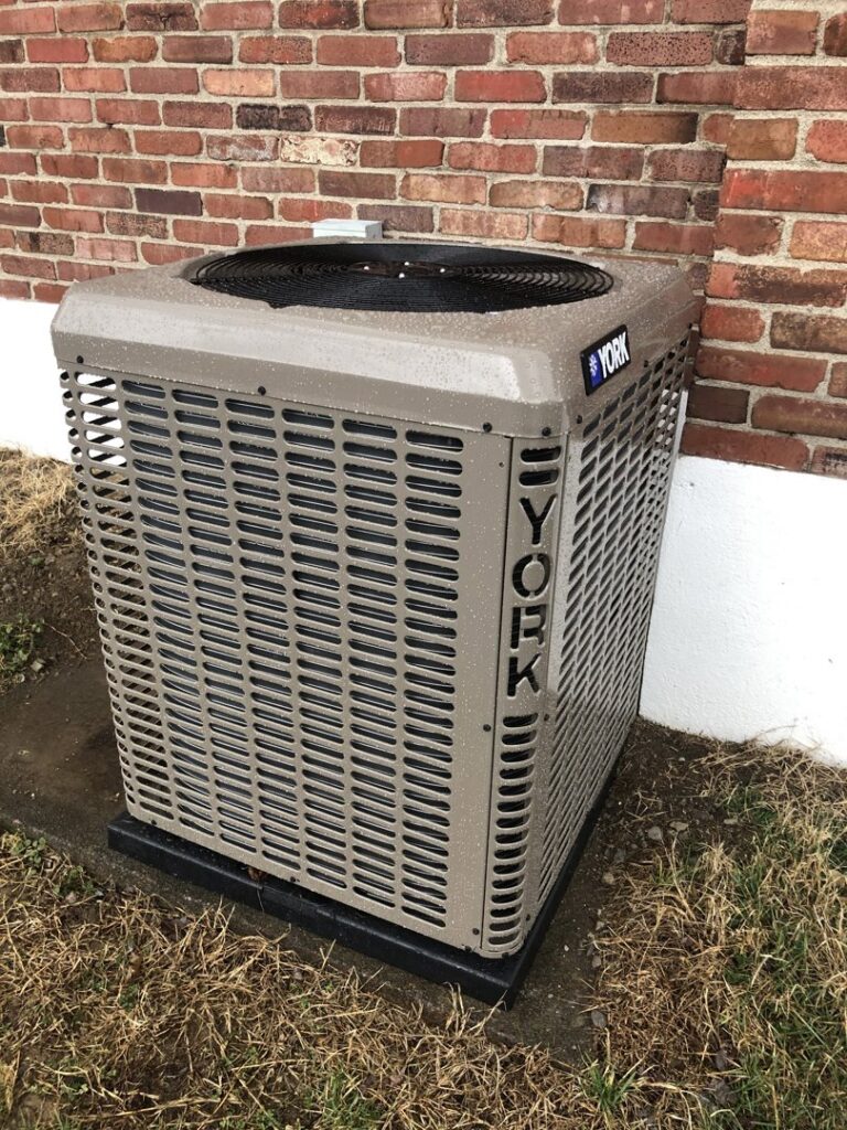 An outdoor YORK air conditioning unit installed by Wright Heating and Air in Louisville, KY.