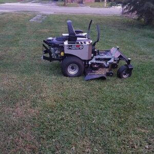 A large zero-turn riding lawnmower ready for service by Mcfaith Lawn Care LLC in New Orleans, LA.