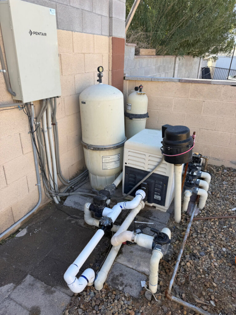 An advanced pool equipment installation featuring multiple filters and a heater, expertly set up by Purpose Pools in Henderson, NV.