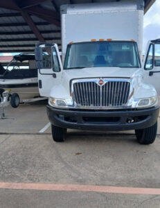 A white Advantage Express Movers truck parked, ready for a job in Arlington, TX.