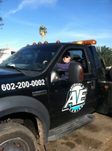 A professional tow truck driver from AE Recovery and Towing in Phoenix, AZ.