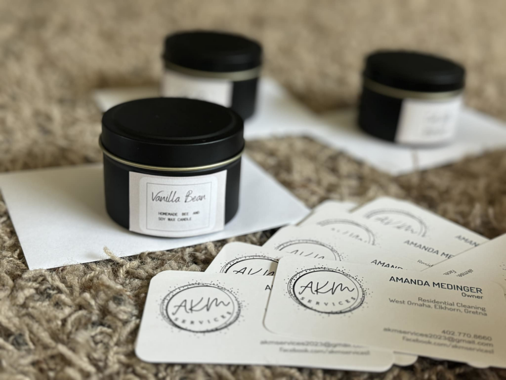 AKM Services residential cleaning business cards with contact information in Omaha, NE