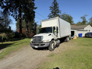 An Alto Moving truck parked outside a house, ready for a moving service in Seattle, WA.