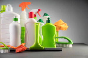 An assortment of cleaning products and tools, including bottles, brushes, and cloths, used by Infinite Cleaning in Minneapolis, MN.