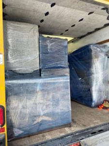 The back of a moving truck loaded with carefully wrapped furniture and boxes by Piece by Peace Moving in Colorado Springs, CO.