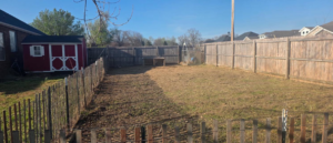 A backyard lawn ready for maintenance by All in- Landscaping and Power-washing in Fayetteville, AR.