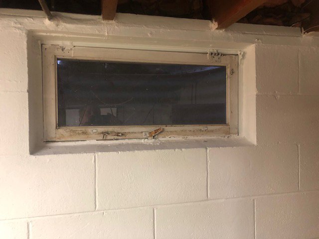 A newly installed glass block window in a basement, a common waterproofing solution provided by Northeast Wisconsin Waterproofing, LLC in Green Bay, WI.