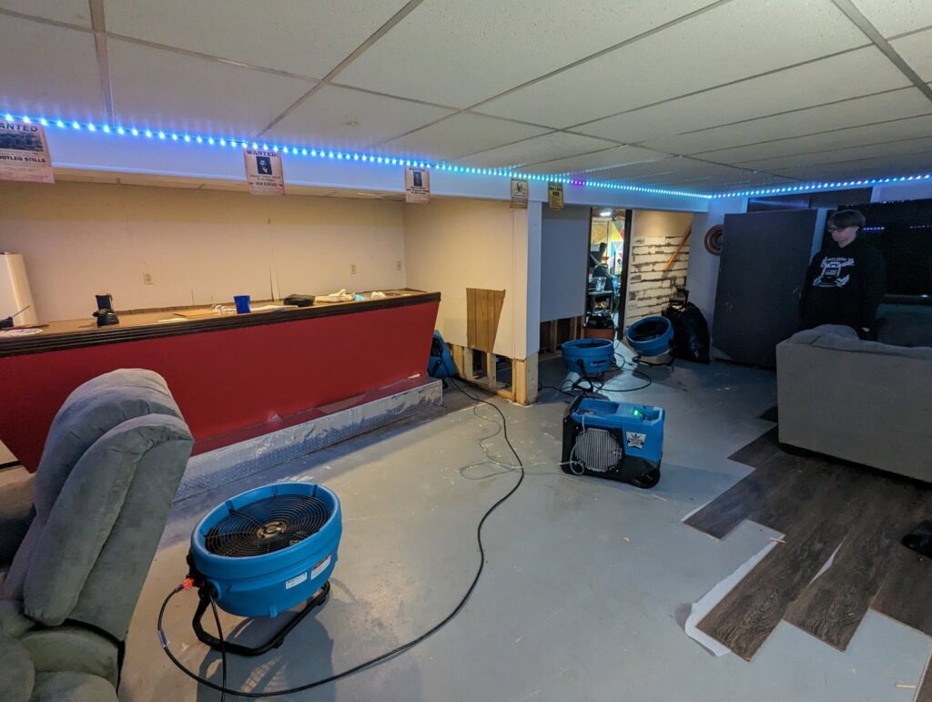 Industrial drying equipment in a residential basement after water damage, managed by Prime Restoration in Lancaster, PA.