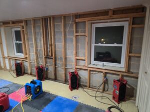 Air movers and dehumidifiers drying a basement after water damage restoration by 1d Remedy LLC in Mechanicsburg, PA