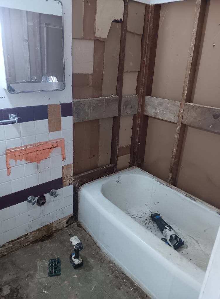 Full bathroom demolition for water damage remediation by Integrity Solutions in Omaha, NE.
