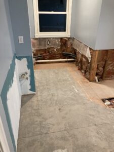 A bathroom undergoing renovation and demolition with walls stripped and pipes exposed by Clean Slate Demolition in Rock Hill, SC.