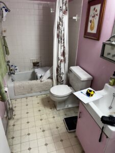 A bathroom showing water damage and repair work in progress around the bathtub by RestoPros of Eastern & Central Maine in Bangor, ME.