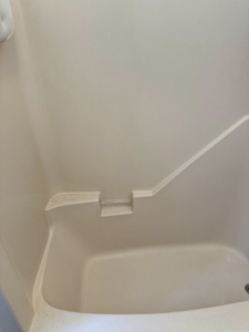 A bathtub showing grime and dirt before a professional cleaning service from Spotless Cleaning Operations LLC in Lancaster, PA.