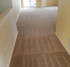 Before and after view of a bedroom carpet cleaned by EE Cleaning and Restoration in Colorado Springs, CO.