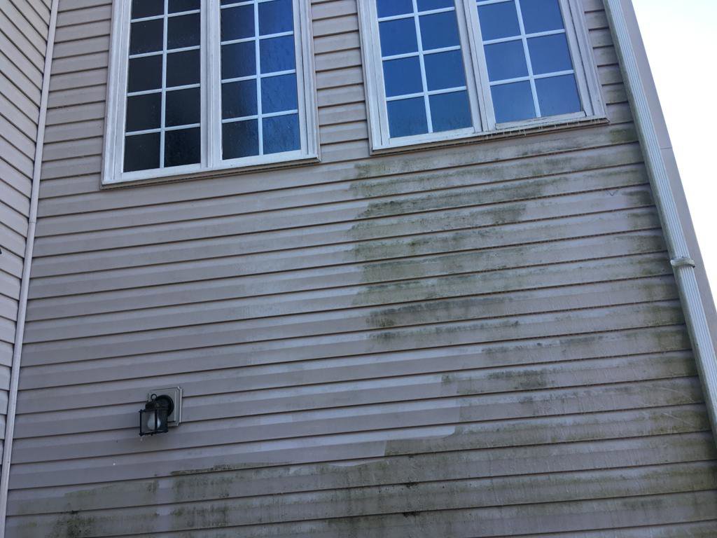Before and after pressure washing house siding, demonstrating exterior cleaning by Deep Cleaning Service in Frederick, MD.
