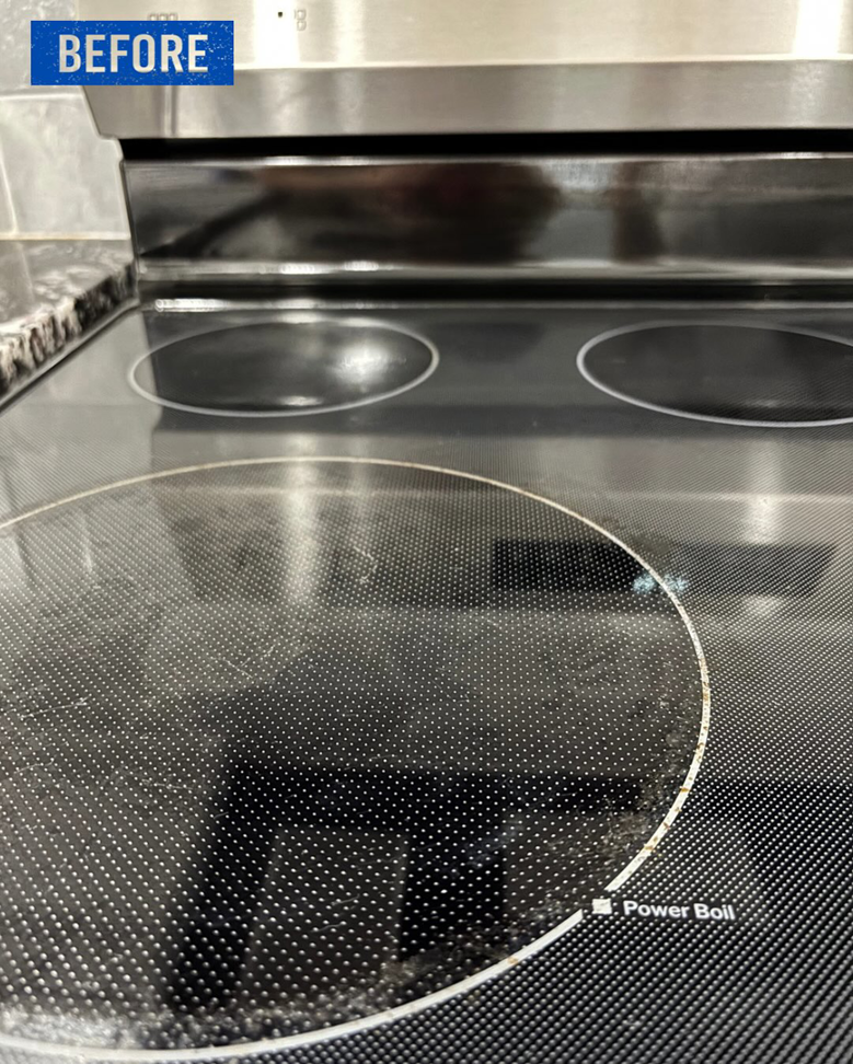 A close-up of a dirty glass stovetop before cleaning by Top Tier Philly in Philadelphia, PA.