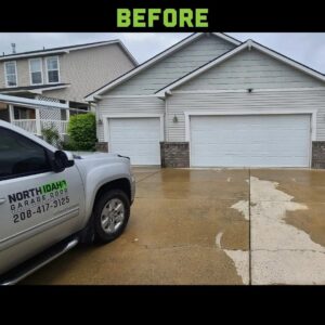 Before photo showing two old white garage doors on a residential home, ready for replacement by North Idaho Garage Door in Coeur d'Alene, ID.