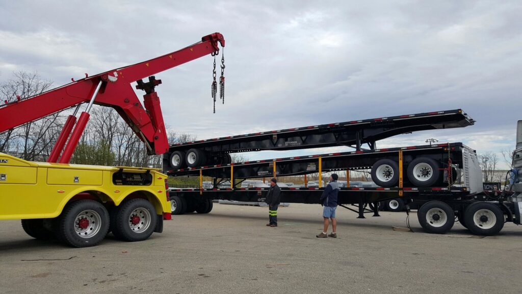 Bevis Towing performing recovery of a large white dump truck stuck off the road in Cincinnati, OH.