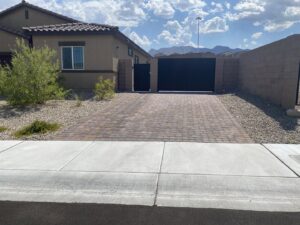 Black double driveway and pedestrian gates installed by Giddy Up Garage Doors & Iron in Las Vegas, NV.