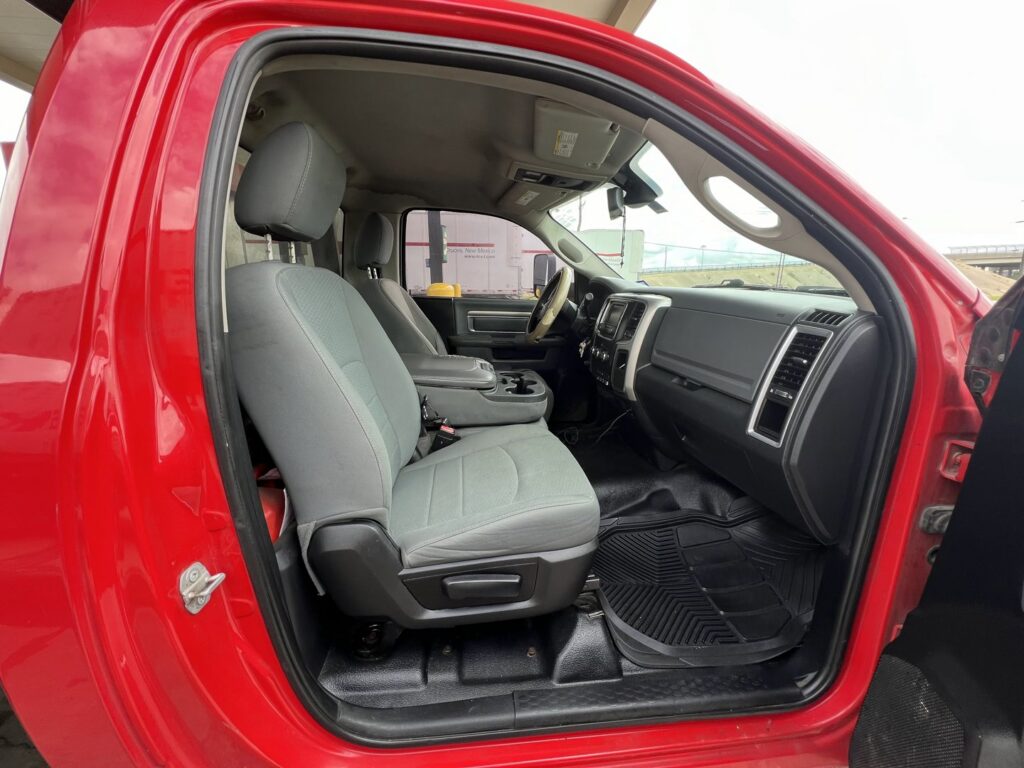 A black SUV loaded on a flatbed tow truck for RDZ Towing Service 24/7 in Dallas, TX.