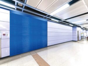 A blue rolling steel commercial garage door installed in a modern interior space by Wayne Dalton Sales & Service of Quad Cities in Davenport, IA.