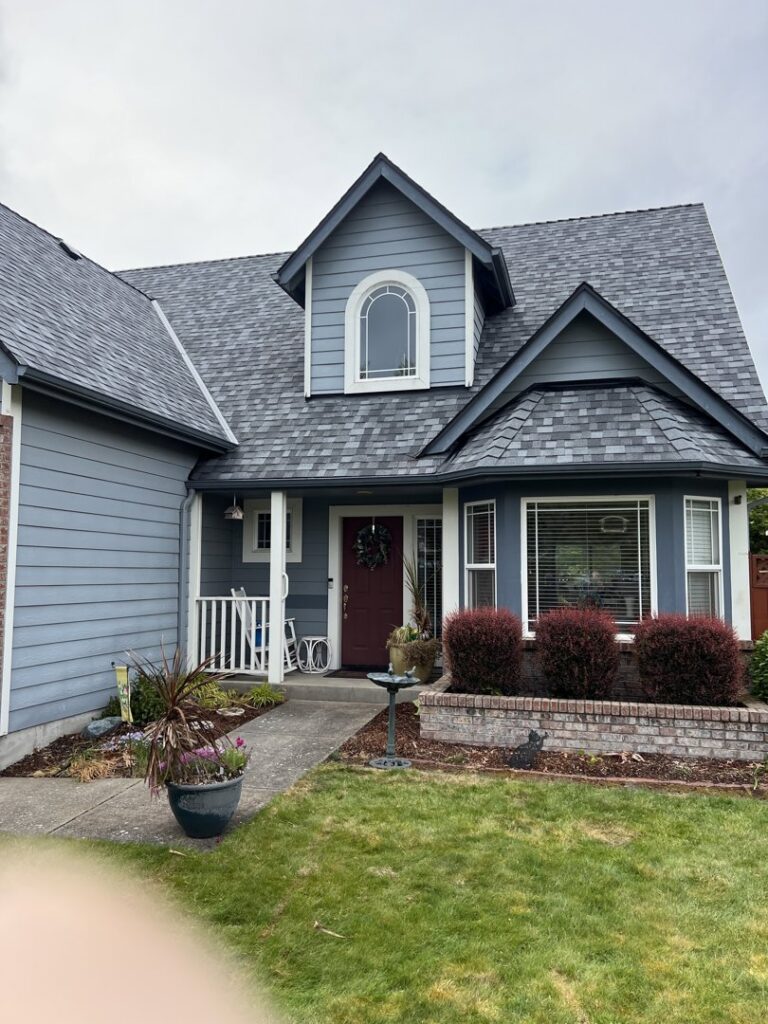 A completed blue siding installation project on a residential home by High Performance Homes in Vancouver, WA
