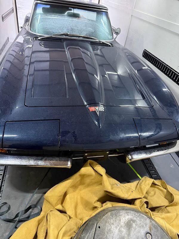 A blue vintage car secured inside an enclosed trailer for transport by B'ham Trailer Rentals in Alabaster, AL.
