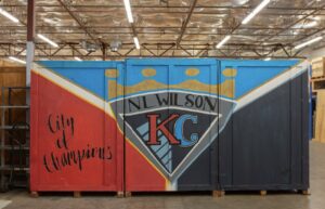 A branded storage container with 'N.L. Wilson KC City of Champions' logo from N. L. Wilson Moving and Storage in Olathe, KS.